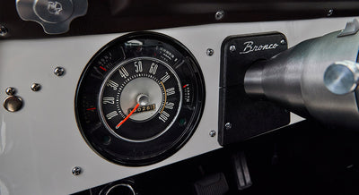 Dashboard speedometer and Bronco emblem on steering column housing of Classic Ford Bronco