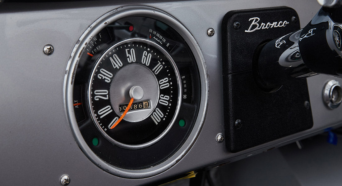 Close-up of a Classic Ford Bronco speedometer showing Bronco branding