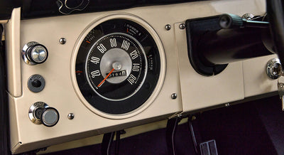 Classic Ford Bronco dashboard speedometer and control knobs in beige and black
