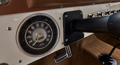Speedometer with brown dashboard and pedal in Classic Ford Bronco interior