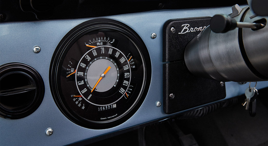 Classic Ford Bronco dashboard speedometer and tachometer with keys in ignition