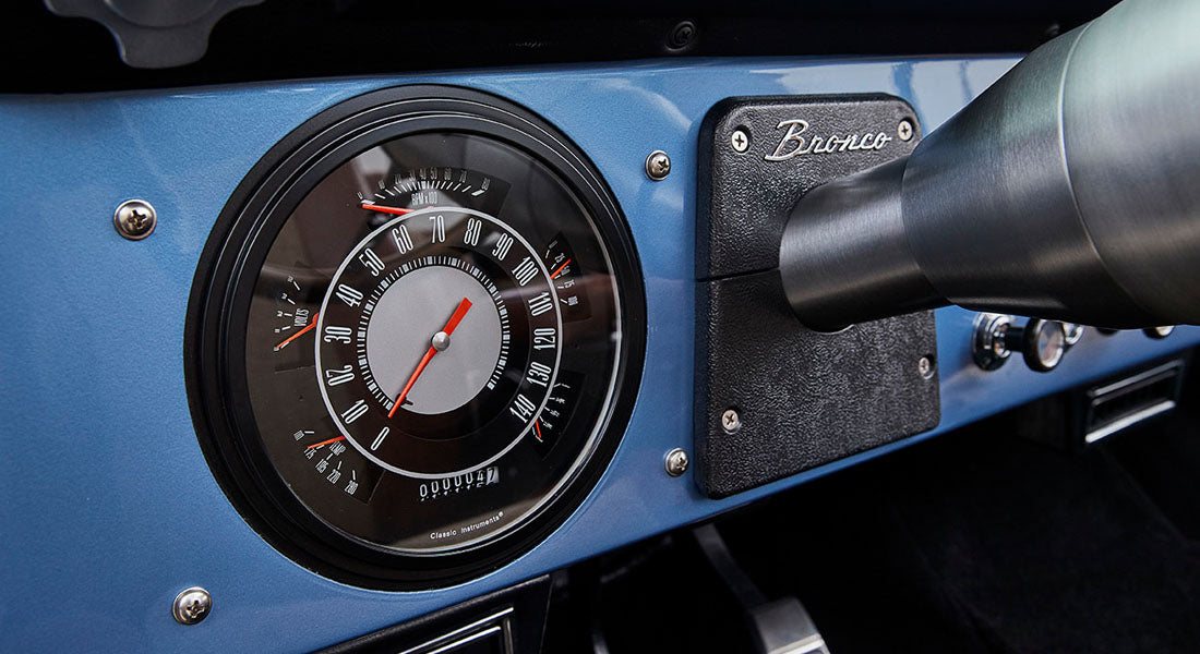 Close-up of Classic Ford Bronco dashboard speedometer and Bronco nameplate