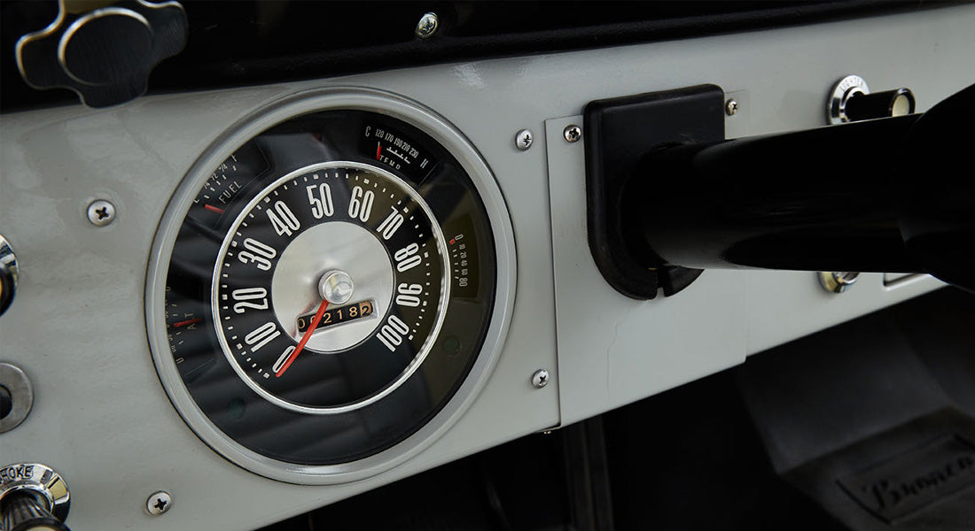 Classic Ford Bronco speedometer with readings up to 100 mph and odometer showing 7182 miles.