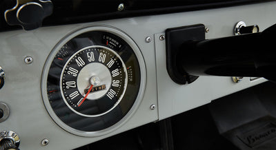 Classic Ford Bronco speedometer with readings up to 100 mph and odometer showing 7182 miles.