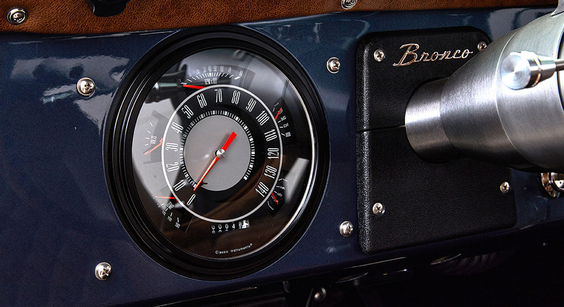 Classic Ford Bronco speedometer and dashboard with black and silver details