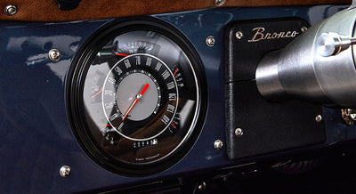 Classic Ford Bronco speedometer and dashboard with black and silver details