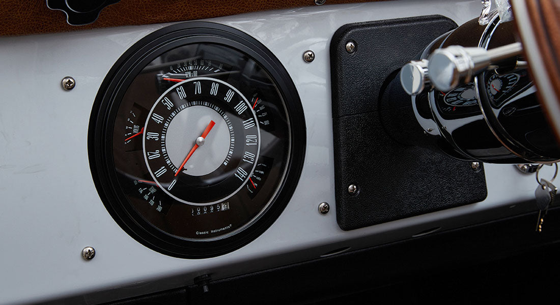 Speedometer gauge cluster showing speed and various indicators inside Classic Ford Bronco