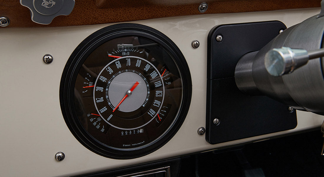 Circular speedometer with odometer and gauges in Classic Ford Bronco dashboard