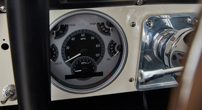Classic Ford Bronco dashboard speedometer with MPH and multiple gauges on beige panel