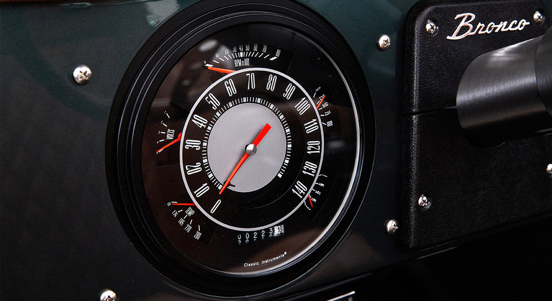 Close-up of Classic Ford Bronco speedometer and dashboard with Bronco lettering