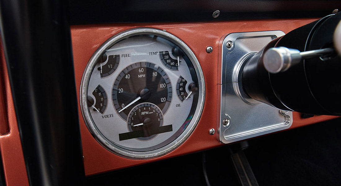 Classic Ford Bronco dashboard speedometer showing various gauges and a 0 mph reading