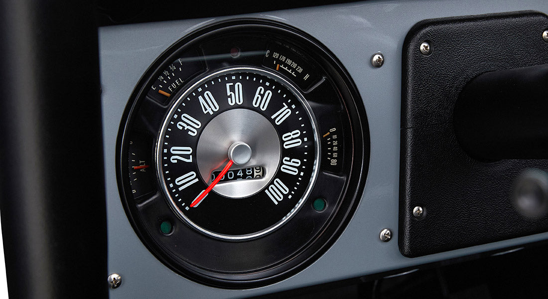 Classic Ford Bronco dashboard speedometer showing speed from 0 to 100 mph