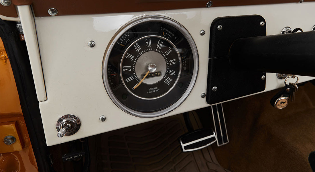 Classic Ford Bronco speedometer and dashboard in white and black with odometer reading