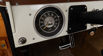 Classic Ford Bronco speedometer and dashboard in white and black with odometer reading