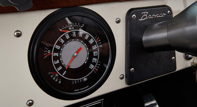 Classic Bronco dashboard speedometer showing zero miles and tachometer up to 7000 RPM