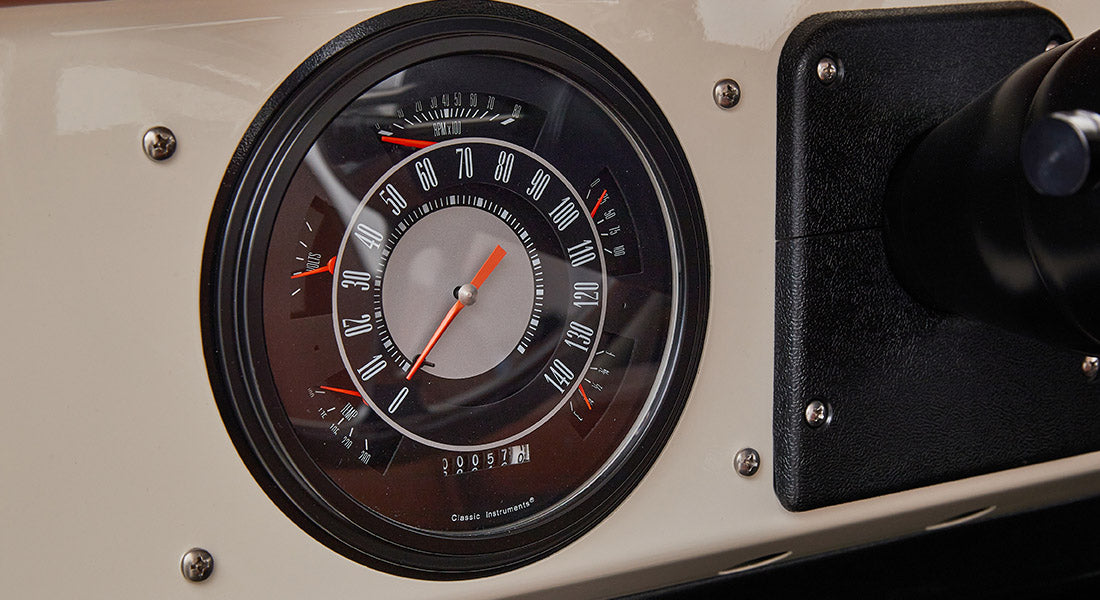 Classic Ford Bronco dashboard speedometer showing speed and RPM in black and gray
