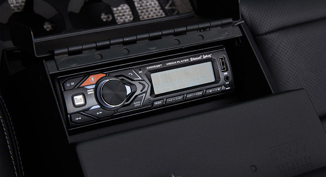 Stereo player unit with USB and Bluetooth controls inside classic Ford Bronco