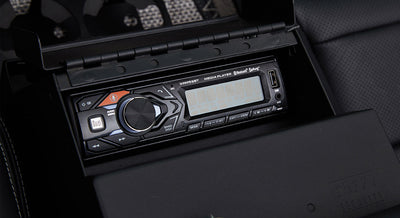 Stereo player unit with USB and Bluetooth controls inside classic Ford Bronco