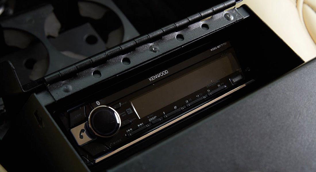 Kenwood stereo system unit installed in classic vehicle interior