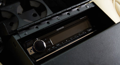 Kenwood stereo system unit installed in classic vehicle interior