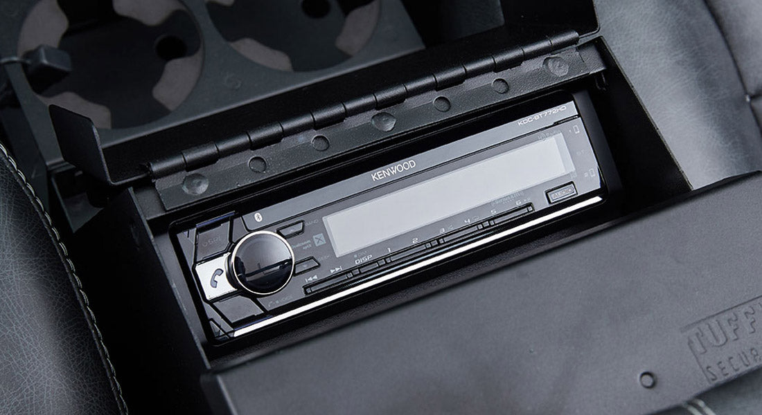 Kenwood stereo system installed in the center console of a Classic Ford Bronco