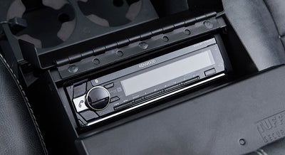 Kenwood stereo system installed in the center console of a Classic Ford Bronco