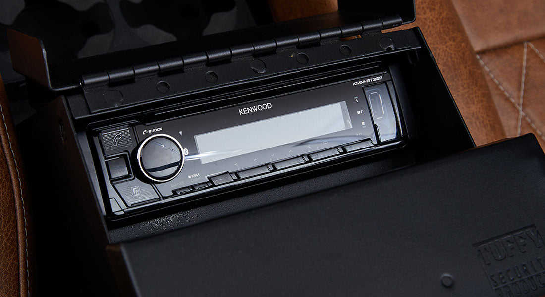 Kenwood stereo system installed in the dashboard compartment of a Classic Ford Bronco