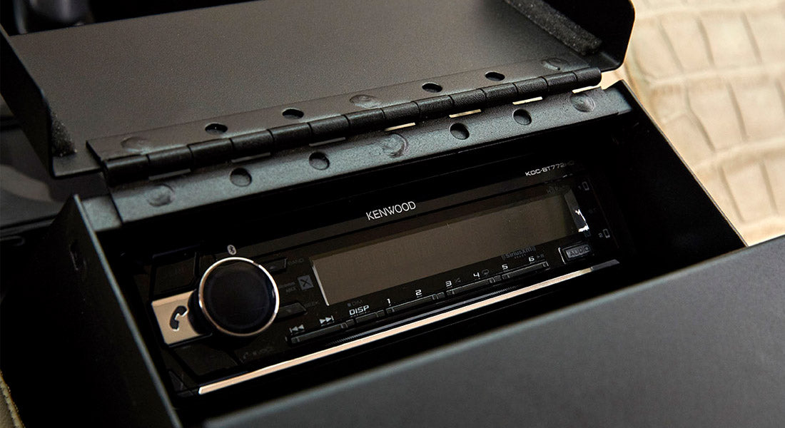 Kenwood stereo installed inside Classic Ford Bronco dashboard compartment