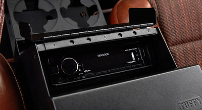Kenwood stereo system installed in the center console of a Classic Ford Bronco