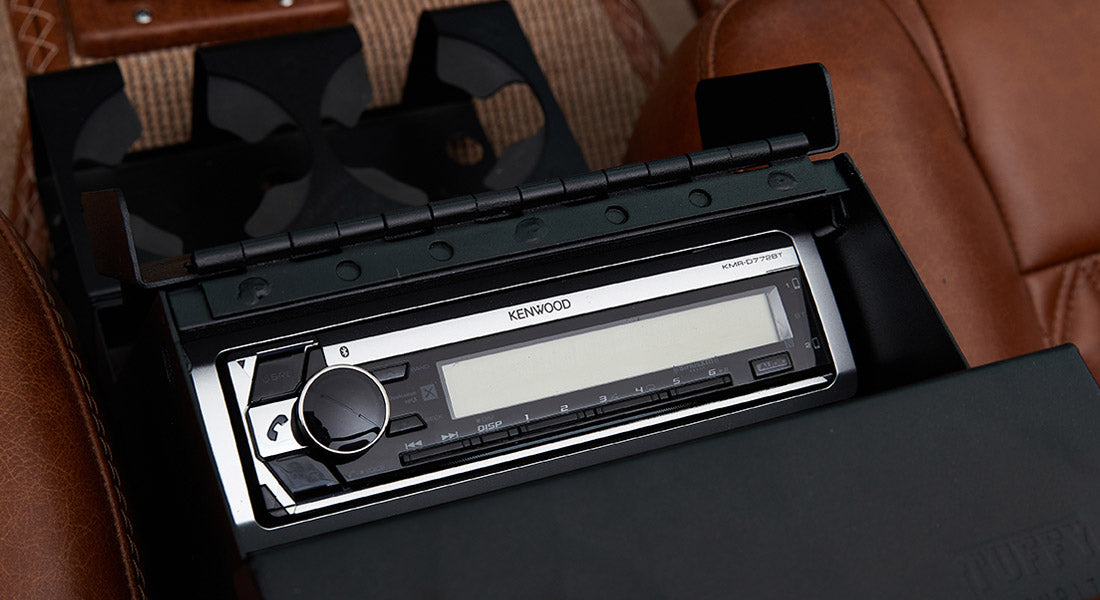 Black Kenwood stereo system installed in Classic Ford Bronco center console