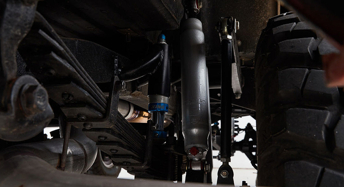Undercarriage suspension components of a Classic Ford Bronco including shocks and leaf springs