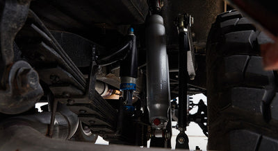 Undercarriage suspension components of a Classic Ford Bronco including shocks and leaf springs
