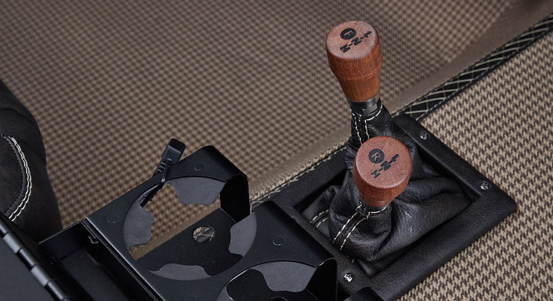 Close-up of two wooden shift knobs for transfer case in Classic Ford Bronco interior