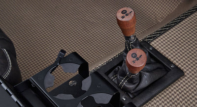 Close-up of two wooden shift knobs for transfer case in Classic Ford Bronco interior