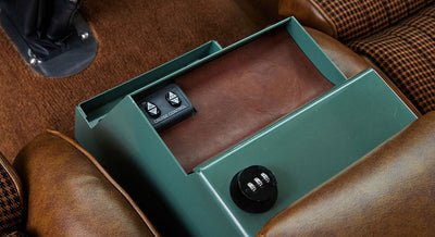 Green metal box with leather insert and cruise control buttons between Classic Ford Bronco seats