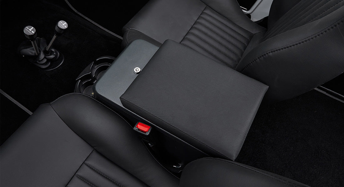 Black leather seats and center console inside a Classic Ford Bronco