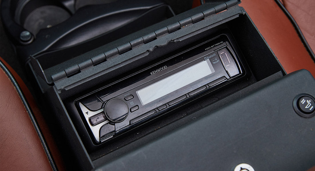 Aftermarket Kenwood stereo system inside Classic Ford Bronco center console