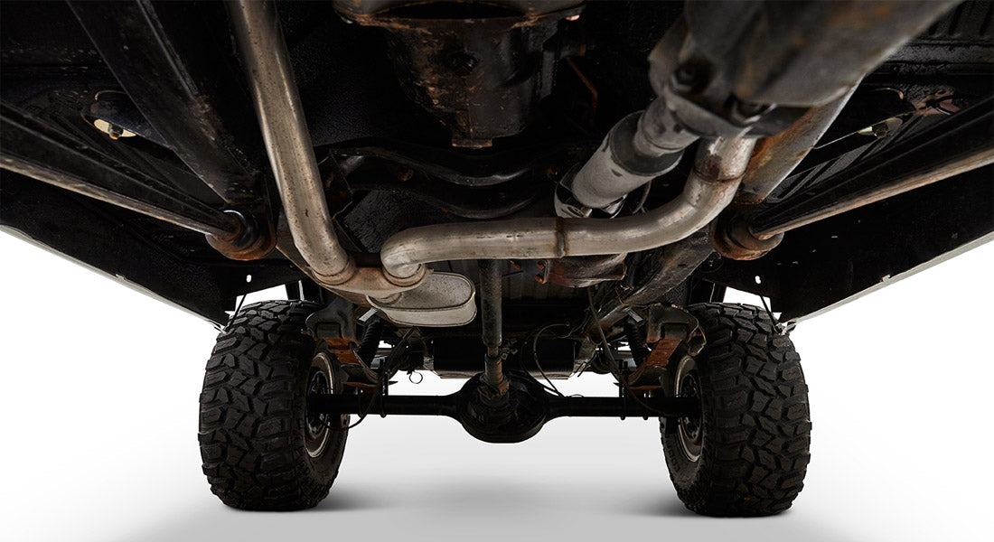 Undercarriage view of Classic Ford Bronco including suspension and exhaust pipes