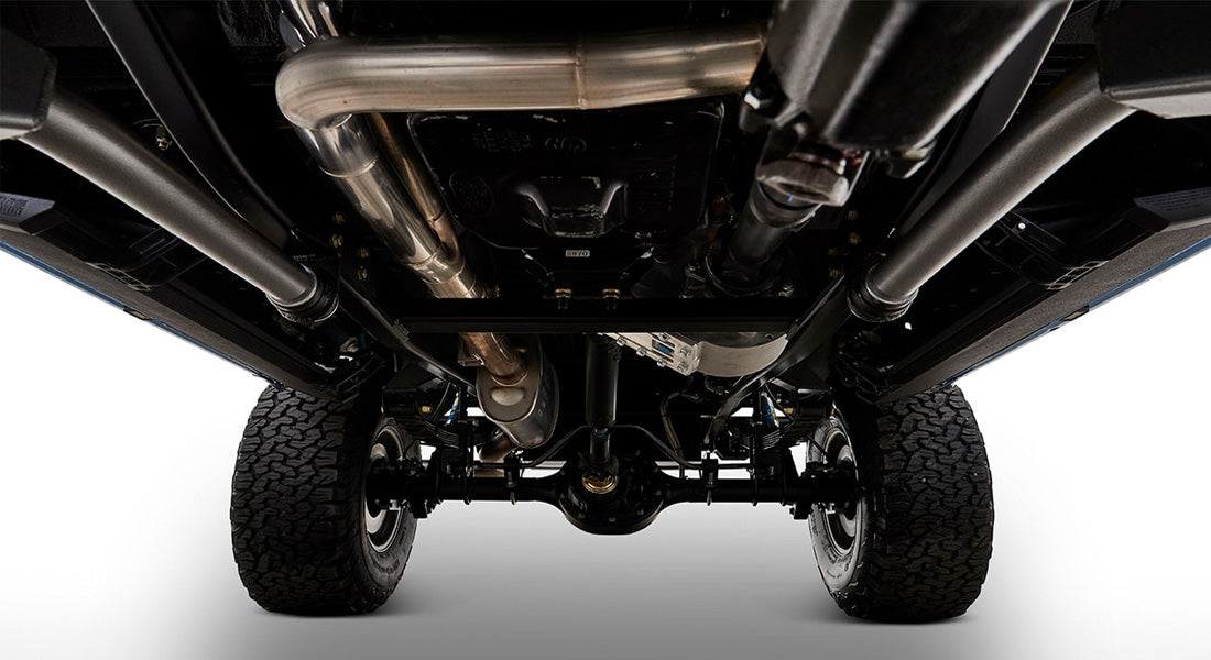 Undercarriage view of Classic Ford Bronco showing black chassis and tires