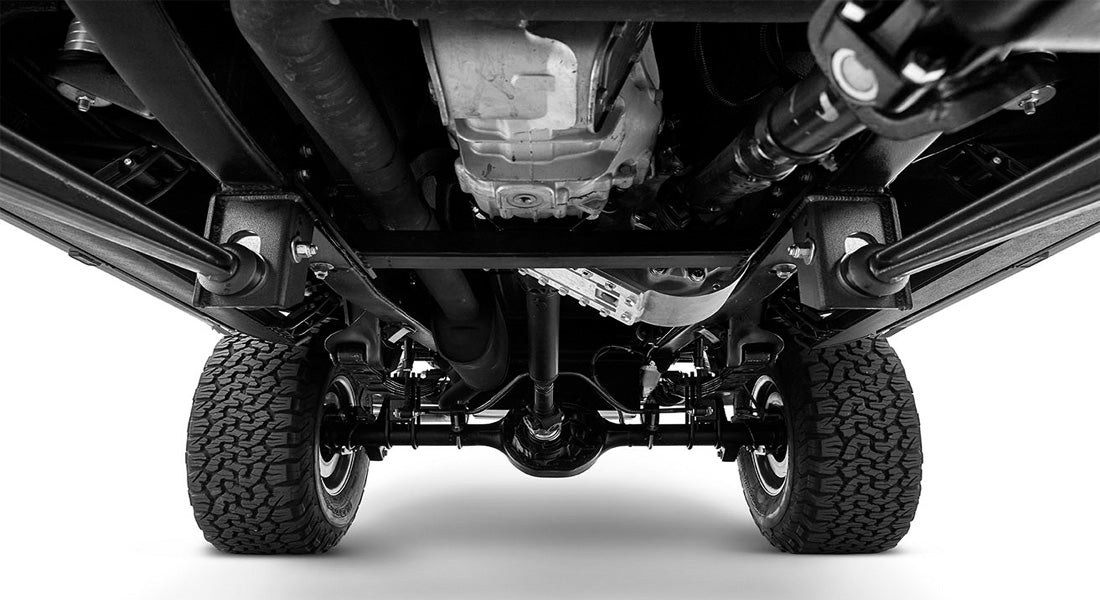 Black and white undercarriage view of Classic Ford Bronco showing rear differential and chassis