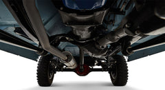 Undercarriage view showing exhaust pipe, drivetrain, and rear axle of a Classic Ford Bronco