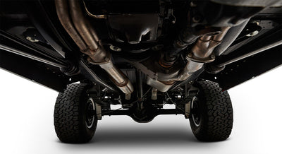 Undercarriage view with tires and exhaust system visible, showing chassis and suspension components