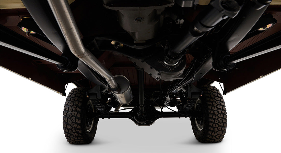 Undercarriage view of Classic Ford Bronco showing tires, suspension, exhaust