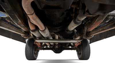 Undercarriage view showing tires, exhaust system and chassis parts of a Classic Ford Bronco