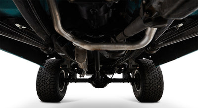 Undercarriage view of a Classic Ford Bronco showing axles, suspension, and exhaust