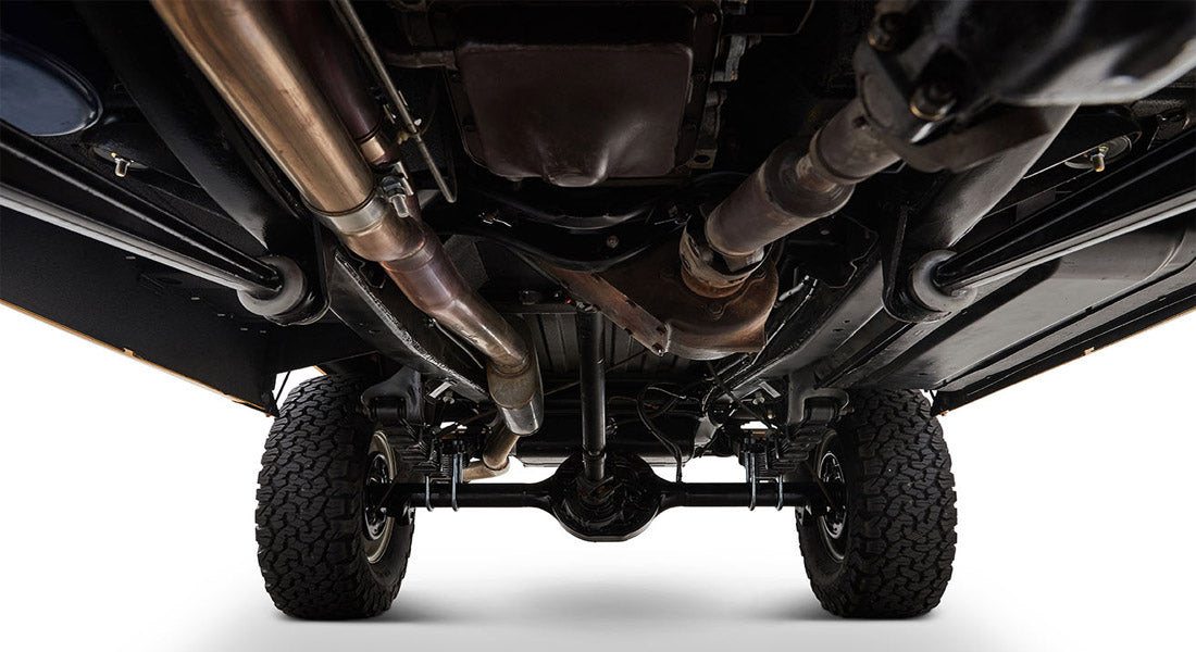 Undercarriage view showing suspension, exhaust, and rear axle of Classic Ford Bronco