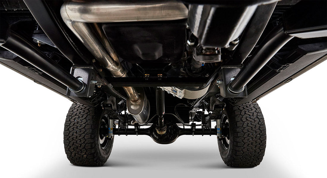 Undercarriage view showing black chassis components and exhaust system of Classic Ford Bronco