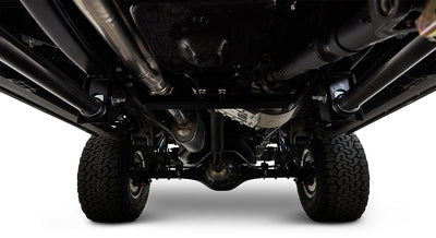 View of undercarriage showing suspension, axles, and tires of Classic Ford Bronco