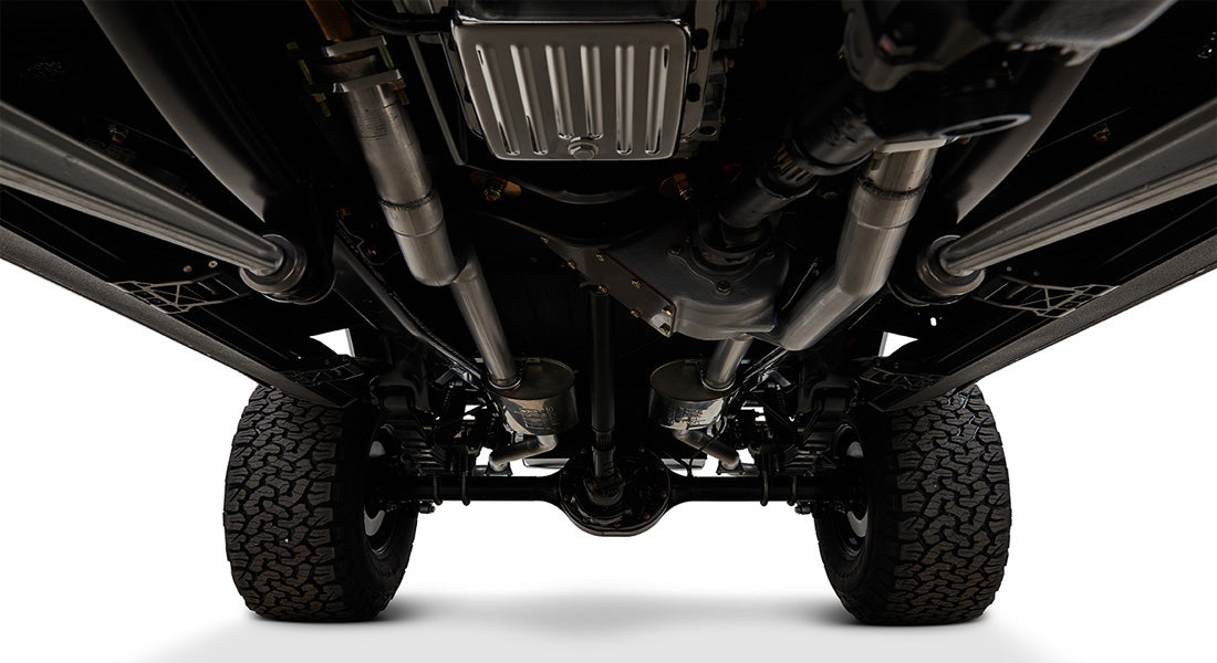 Clean undercarriage view with exhaust system and suspension components of Classic Ford Bronco