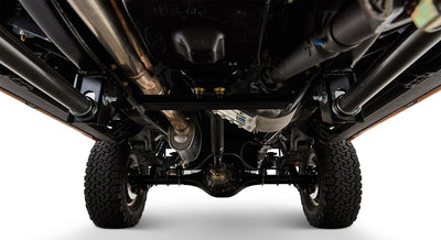 Close-up of Classic Ford Bronco's undercarriage with exhaust pipes and frame visible